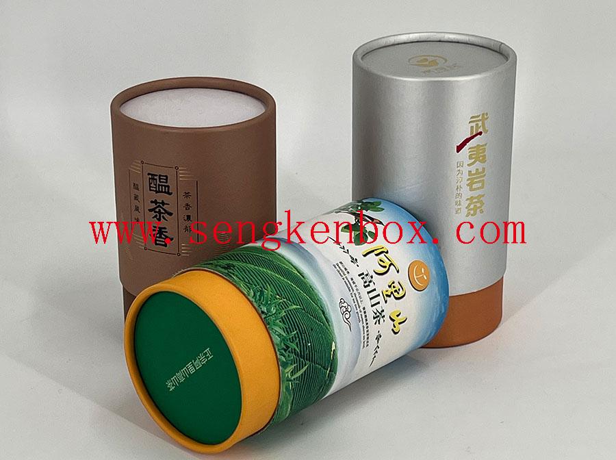 Confezionamento di lattine di tè in carta con bordo arrotolato